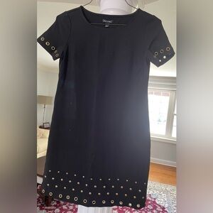 Roze & Ali women’s. Black sheath dress with gold metal Accent designs .